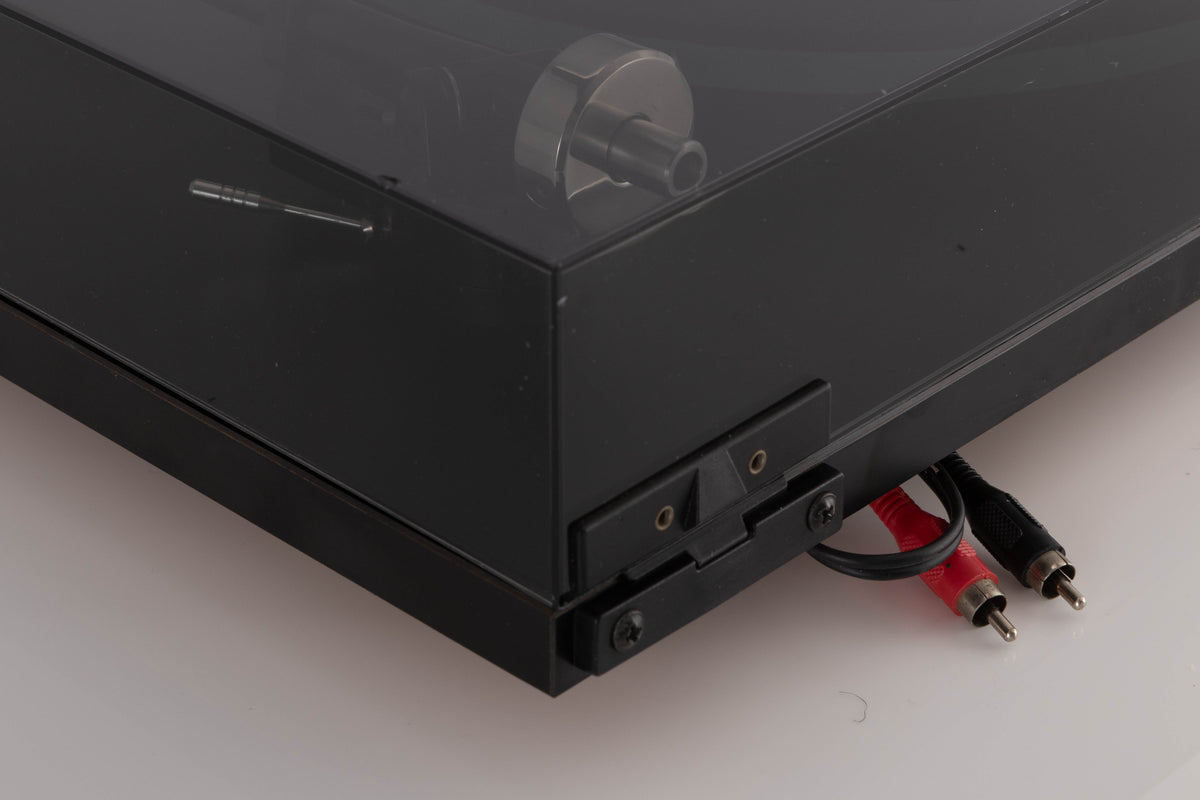 Rear left corner view of a used Rega Planar 3 (24v Upgrade) Turntable in Black with Goldring E3 Cartridge