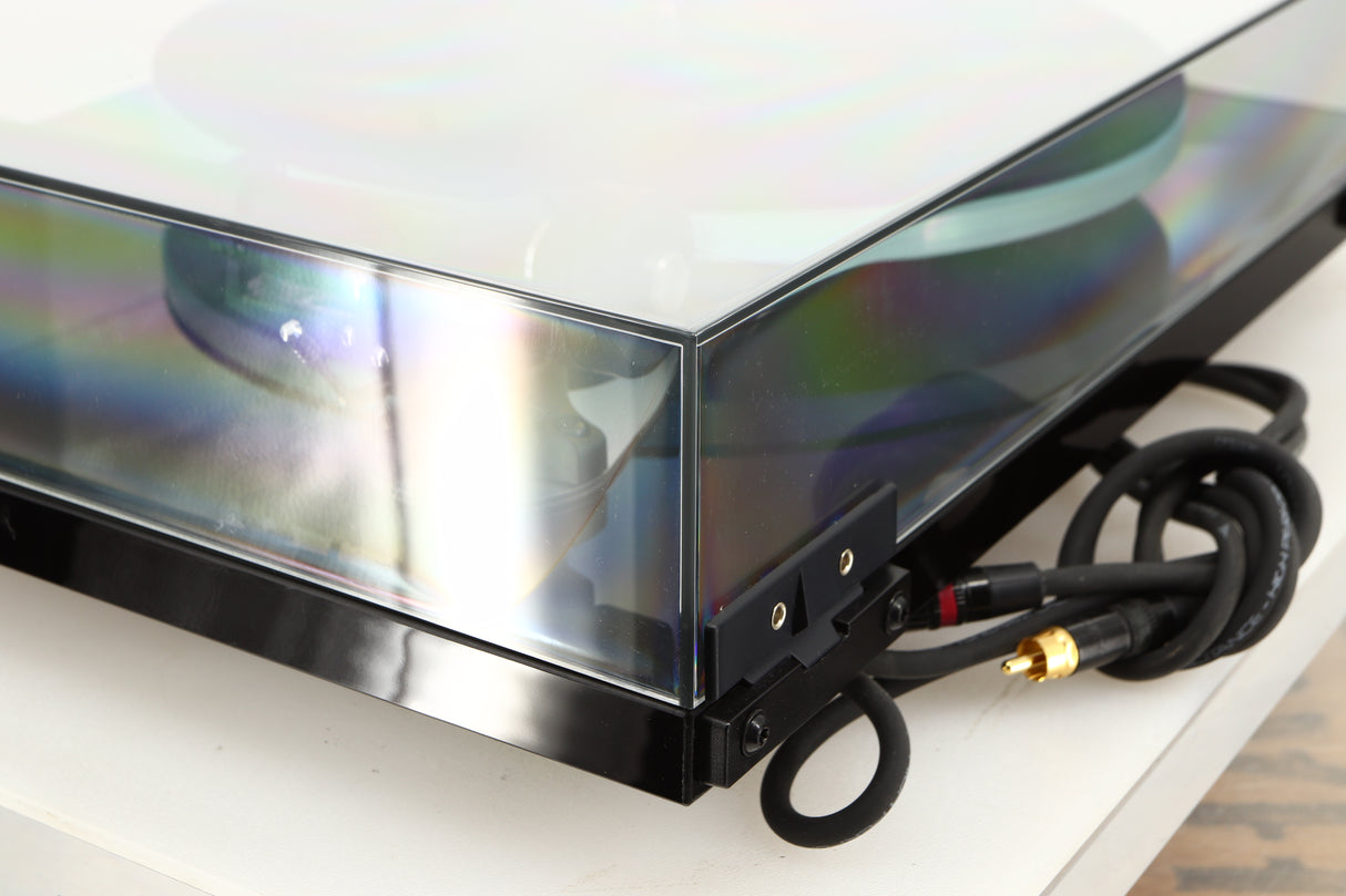 Rear right corner of a used Rega Planar 3 Turntable / Ortofon 2M Bronze Cartridge / NEO Power Supply in a black finish
