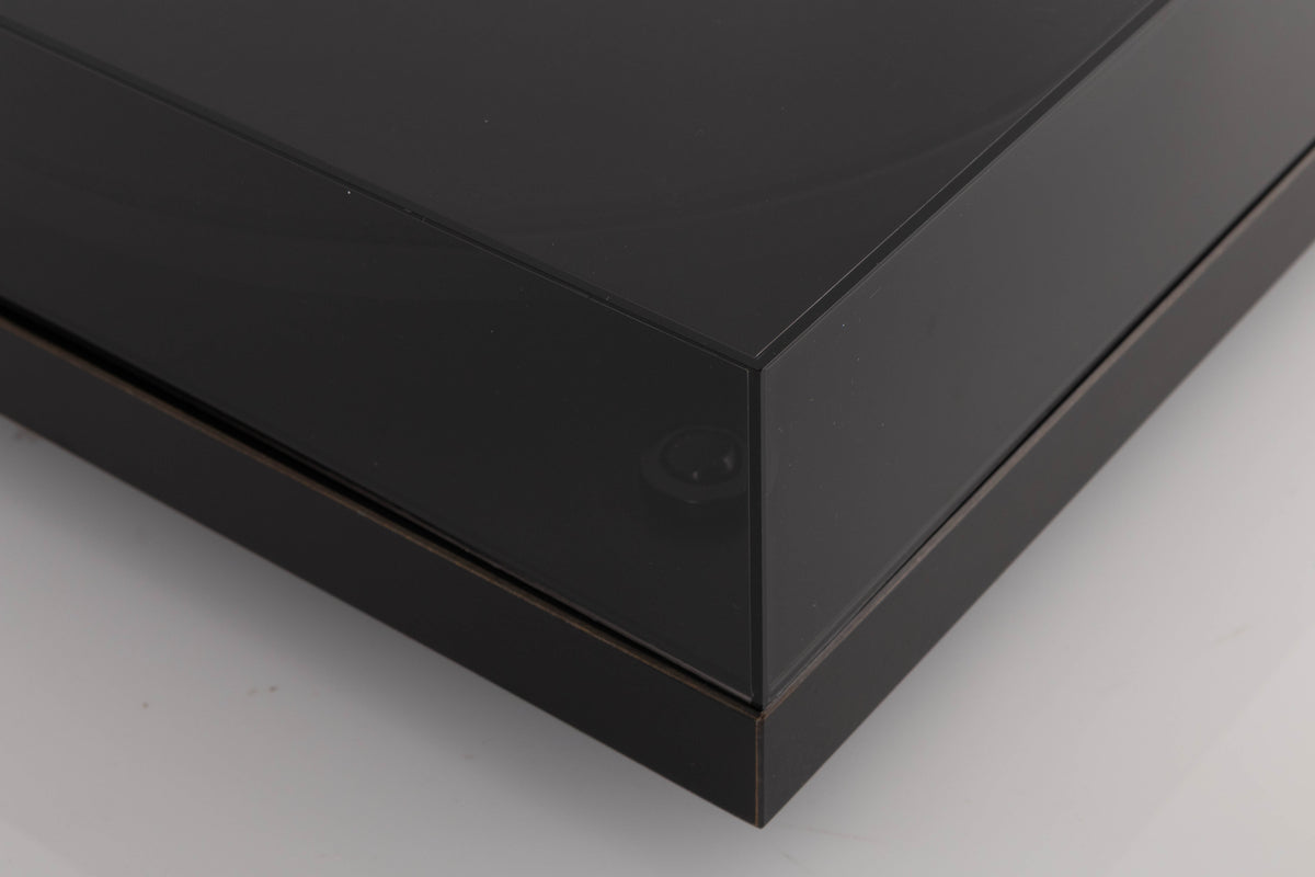 Front left corner of a used Rega Planar 3 Turntable W/ Nagaoka MP11 Boron Cartridge in a Black finish