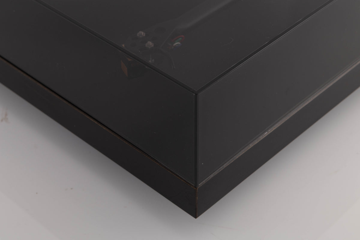 Front right corner of a used Rega Planar 3 Turntable W/ Nagaoka MP11 Boron Cartridge in a Black finish