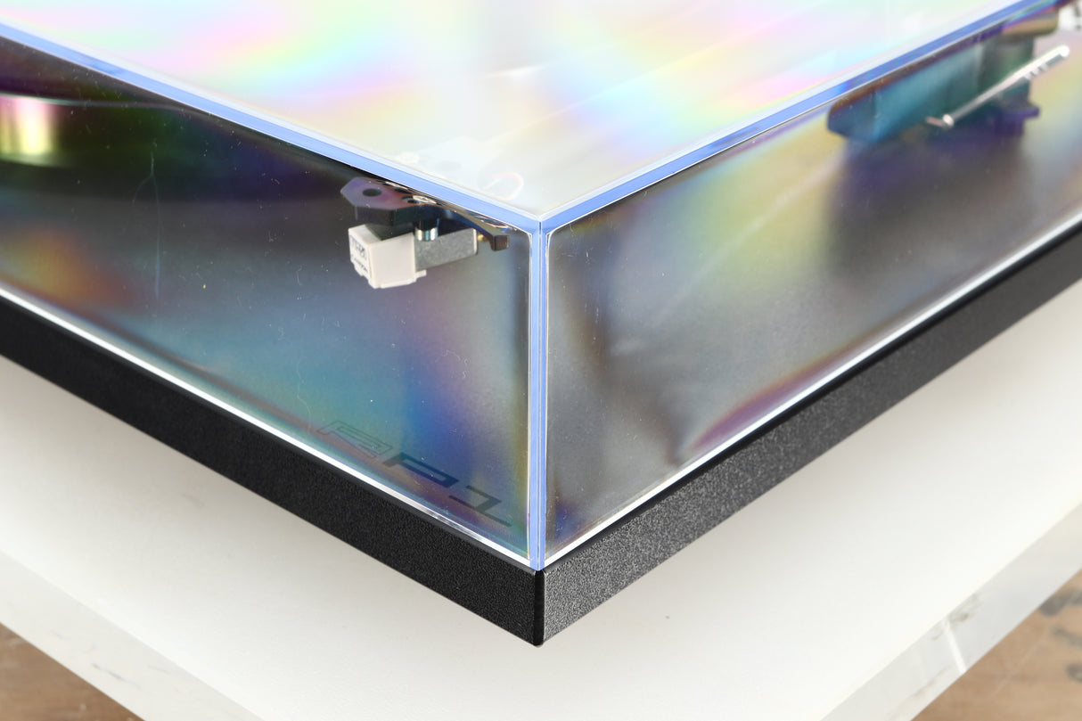 Front right corner of a used Rega Planar RP1 Turntable in a cool grey finish