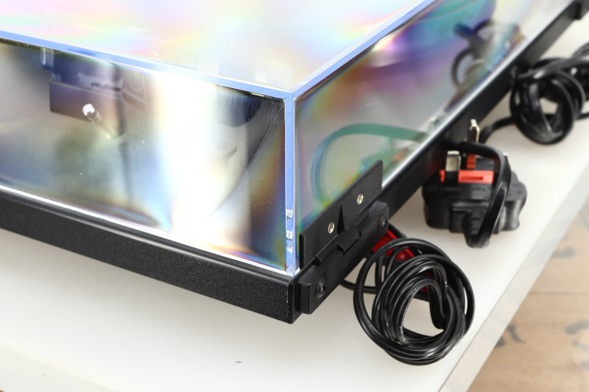 Rear right corner of a used Rega Planar RP1 Turntable in a cool grey finish