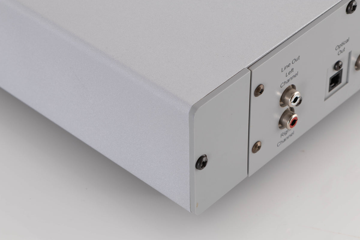 Rear right corner of a used Rega Planet CD Player in a Silver finish