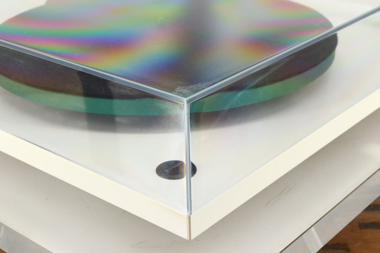 Front left corner of a used Rega RP3 / Exact Cartridge in a white finish