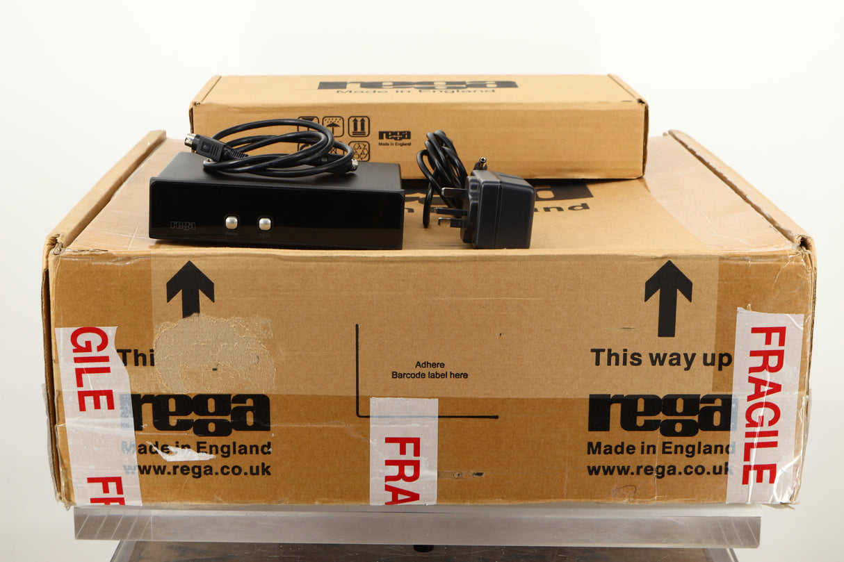 Box of a used Rega RP6 Turntable in Red finish with Exact Cartridge showing TTPSU, mains cable, and PSU cable