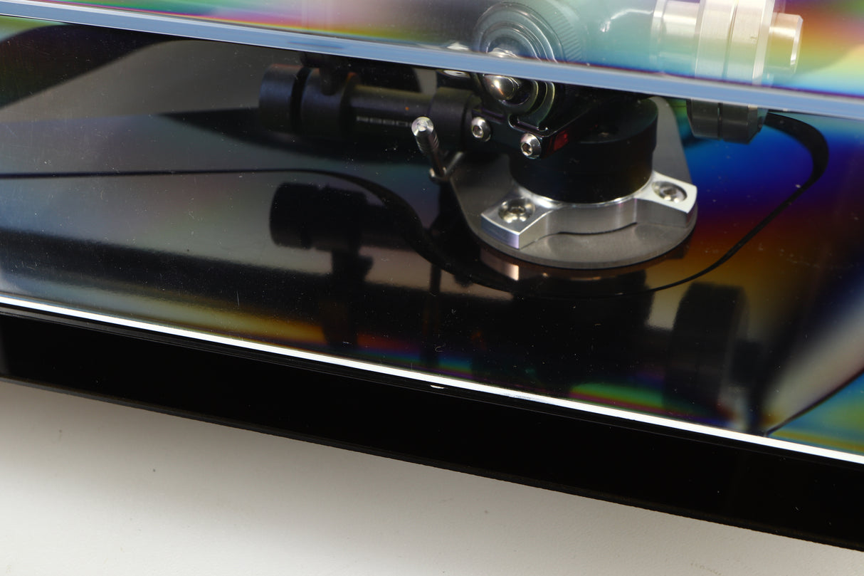 Close up of a used Rega RP8 Turntable / Apheta 2 MC Cartridge in a black finish showing small nick on right edge
