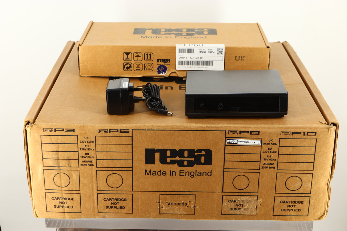 Box of a used Rega RP8 Turntable in Black finish showing TTPSU and mains cable