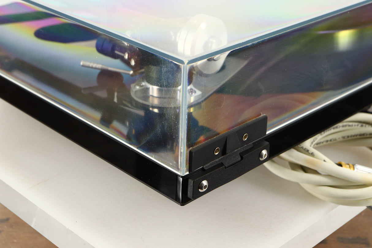 Rear left corner view of a used Rega RP8 Turntable in Black finish