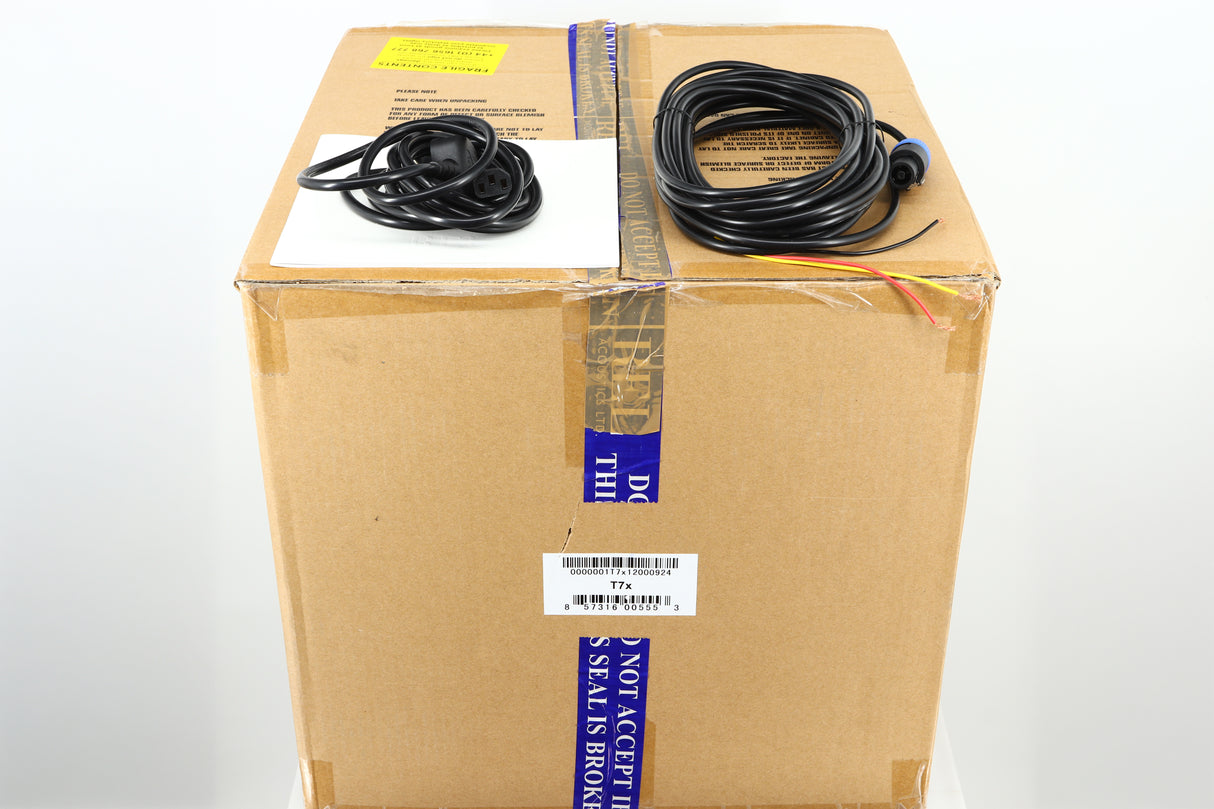 Box for a used REL T-7X Subwoofer in a piano black finish showing Manual, Mains Cable and Hi-Level Cable