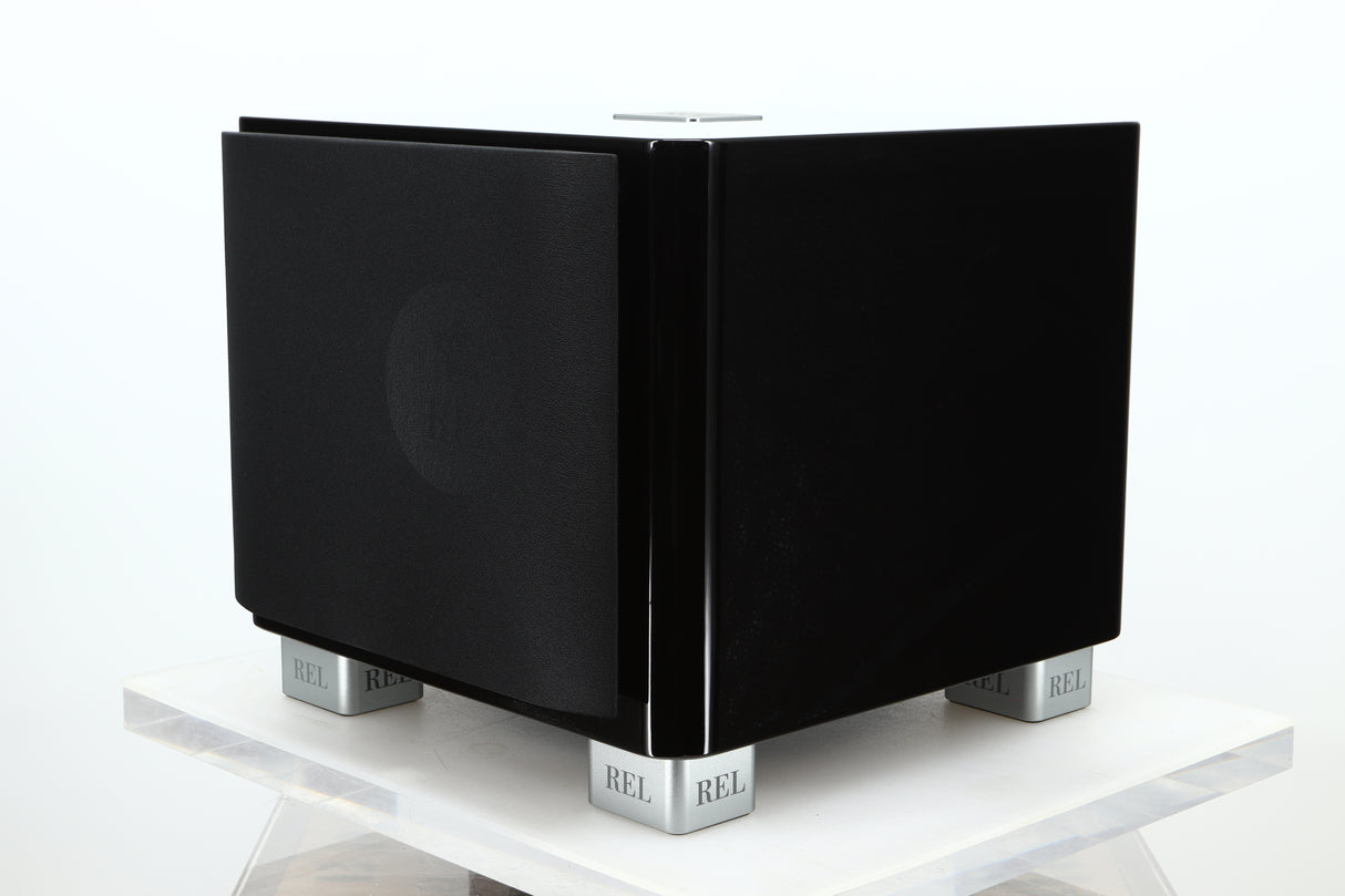 Front right corner of a used REL T-7X Subwoofer in a piano black finish