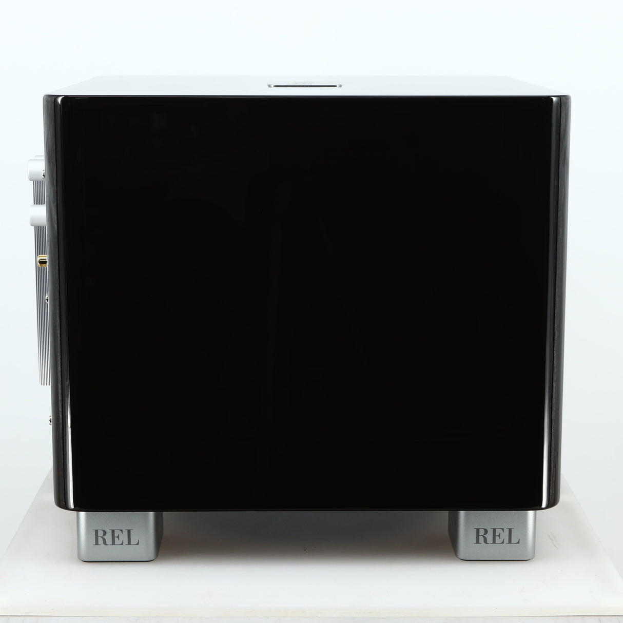 Left side view of a used REL T-7X Subwoofer in a piano black finish