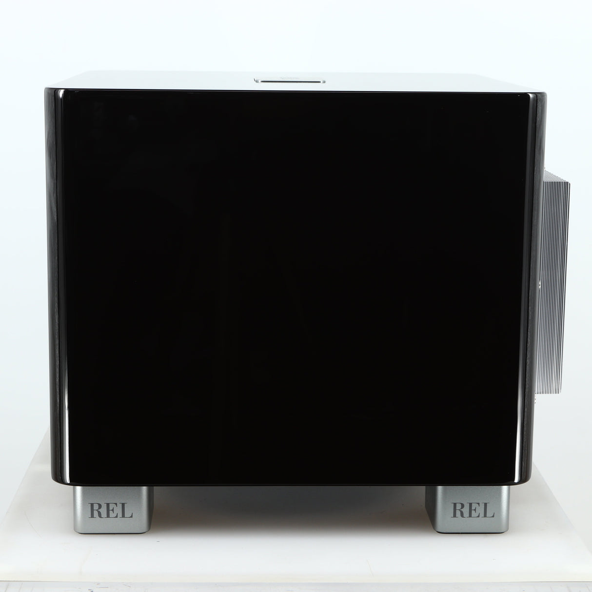 Right side view of a used REL T-7X Subwoofer in a piano black finish