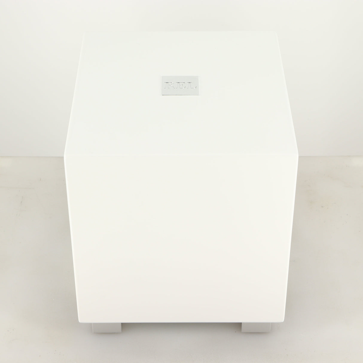 Top of a used REL T-Zero MKIII Subwoofer in a piano white finish
