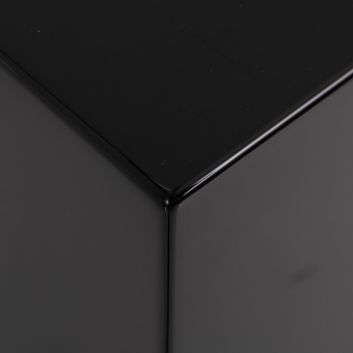 Front left corner of a used REL T5i Subwoofer in a Piano Black finish