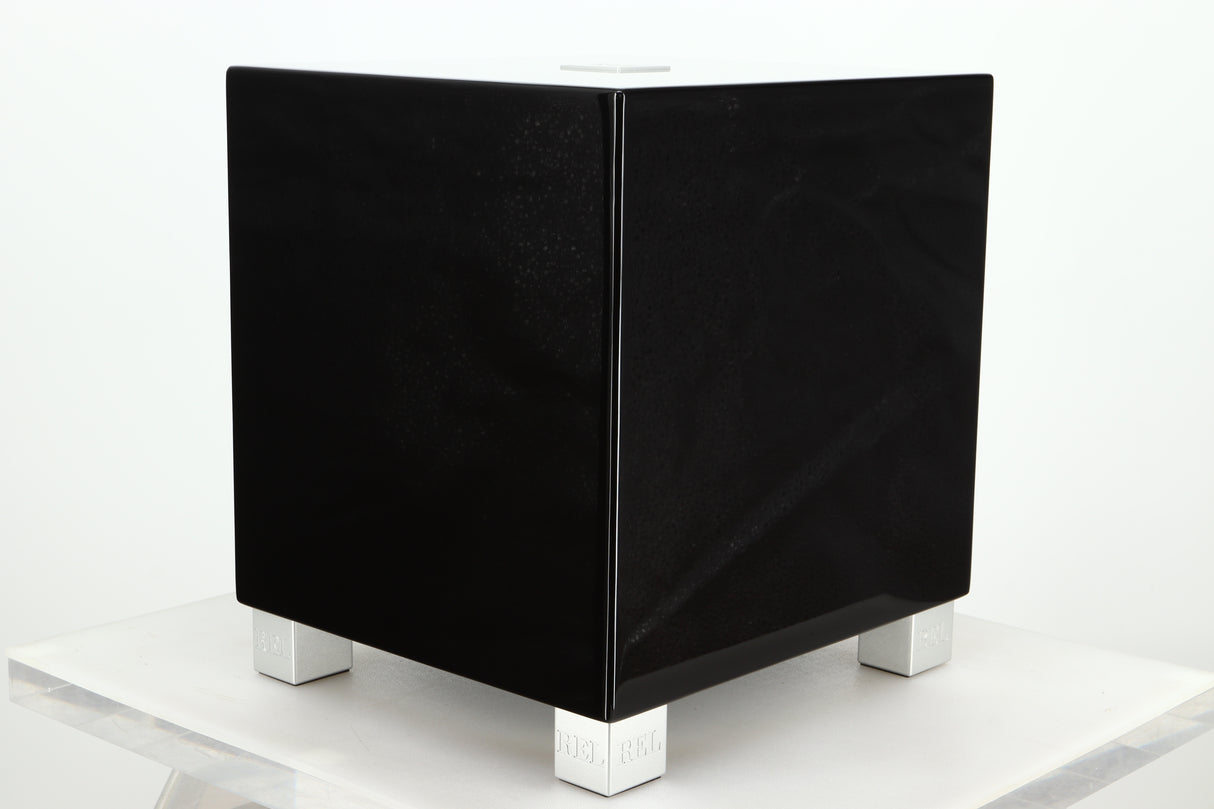 Front right corner of a REL T5i Subwoofer with a piano black finish
