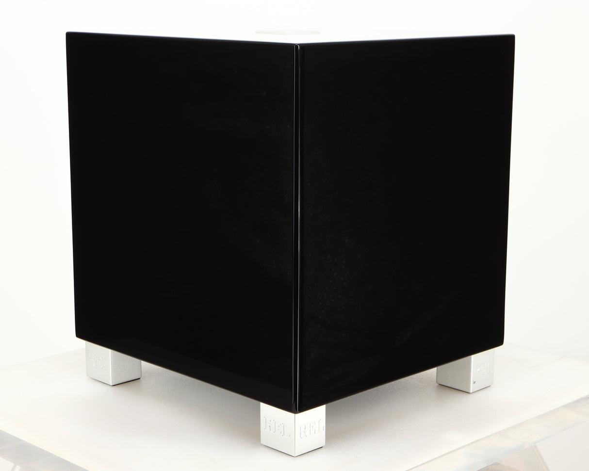 Front left corner of a used REL T5i Subwoofer in a piano black finish