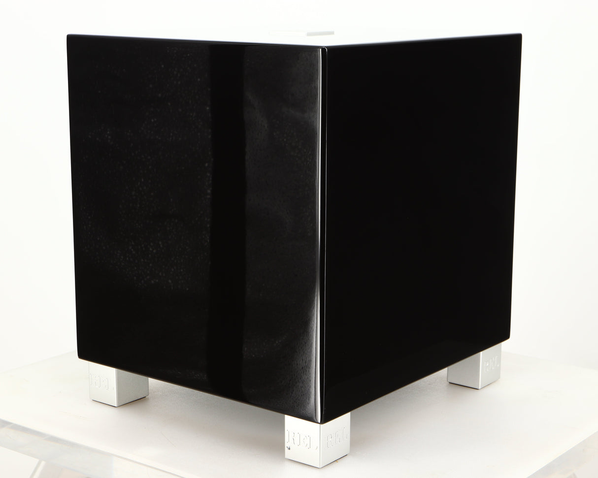 Front right corner of a used REL T5i Subwoofer in a piano black finish