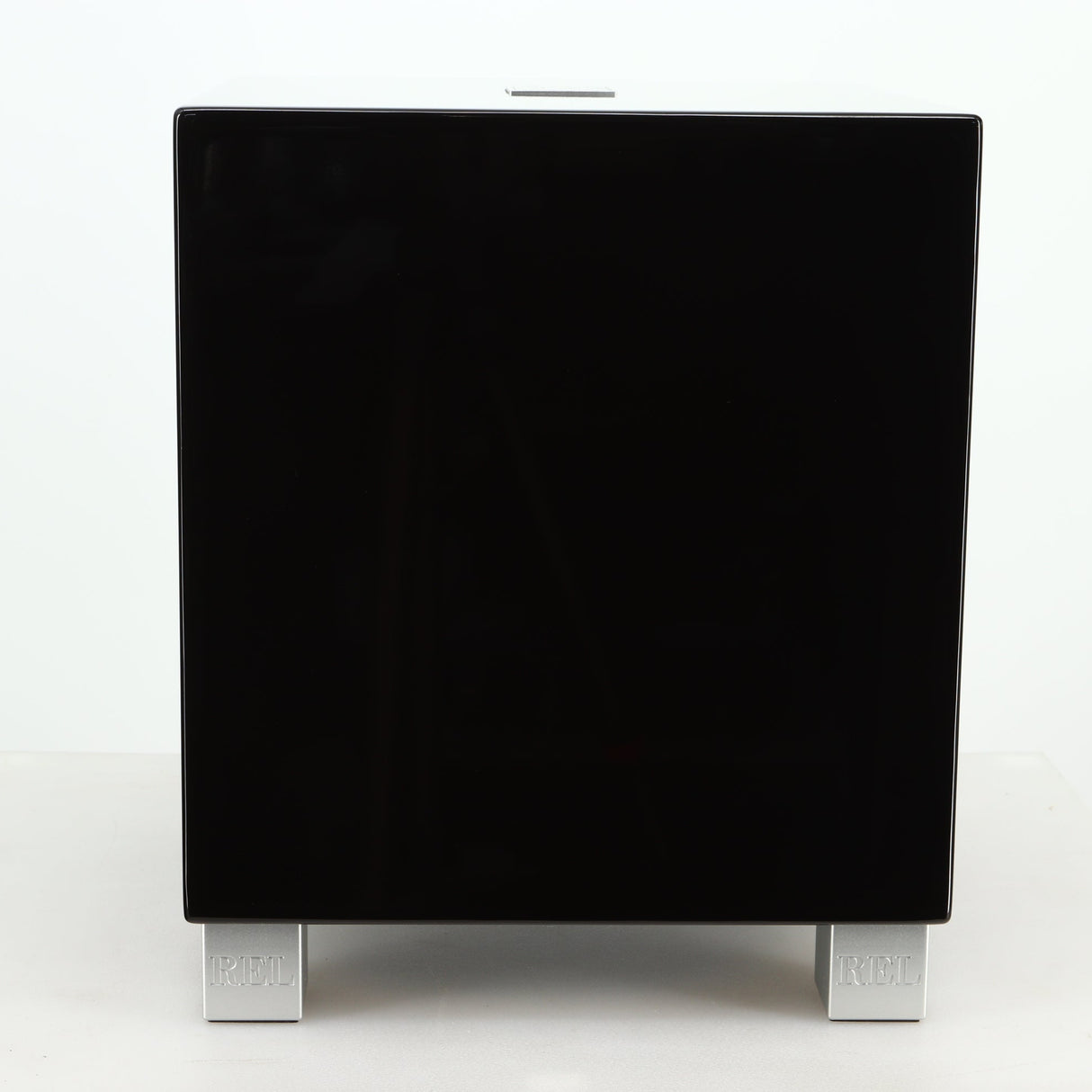 Front view of a REL T5i Subwoofer with a piano black finish