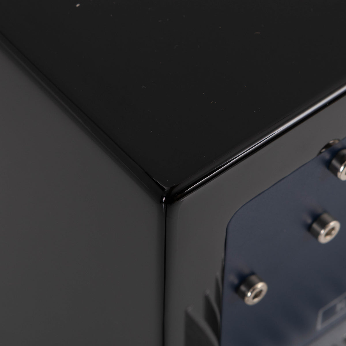 Rear right corner of a used REL T5i Subwoofer in a Piano Black finish