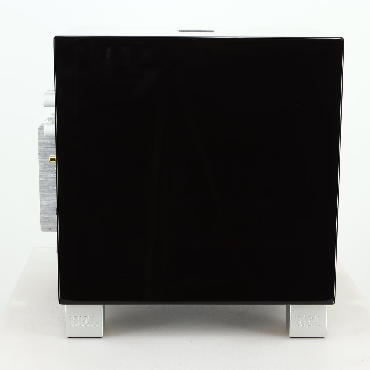 Left side view of a REL T5i Subwoofer with a piano black finish