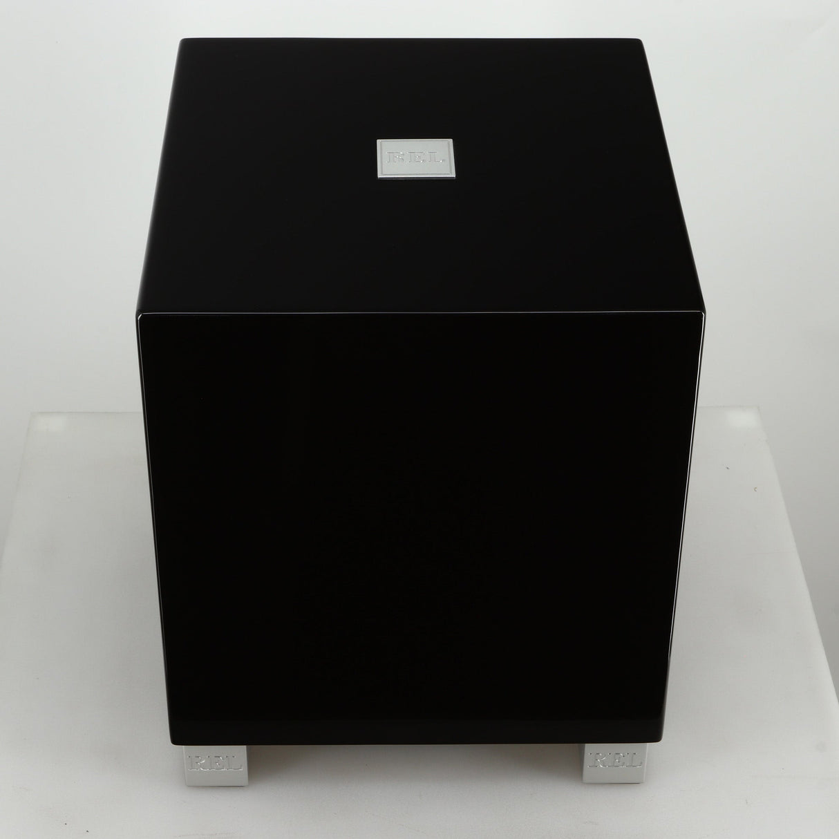 Top view of a REL T5i Subwoofer with a piano black finish