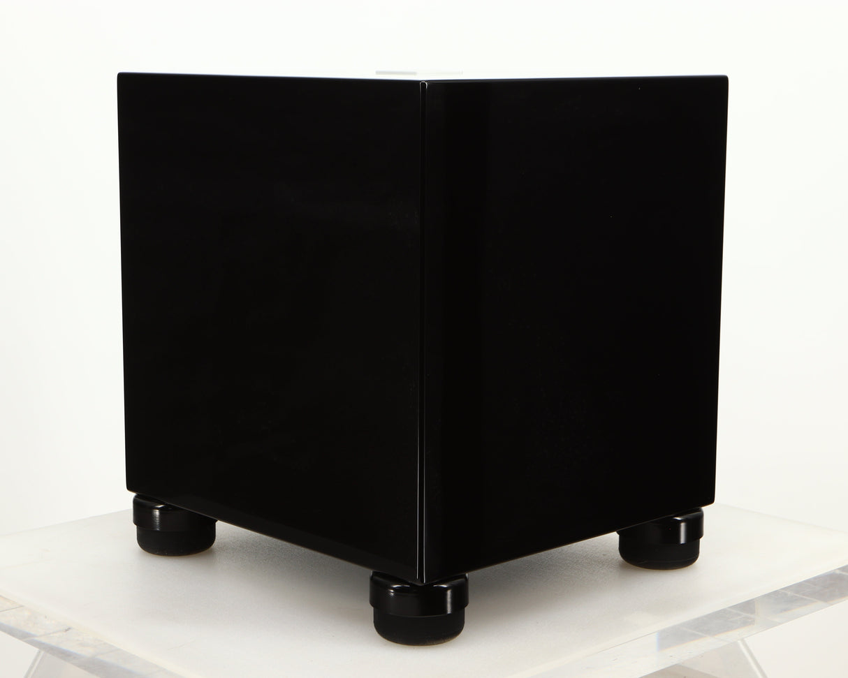Front left corner of a used REL T5i Subwoofer W/ Upgraded Feet in a piano black finish