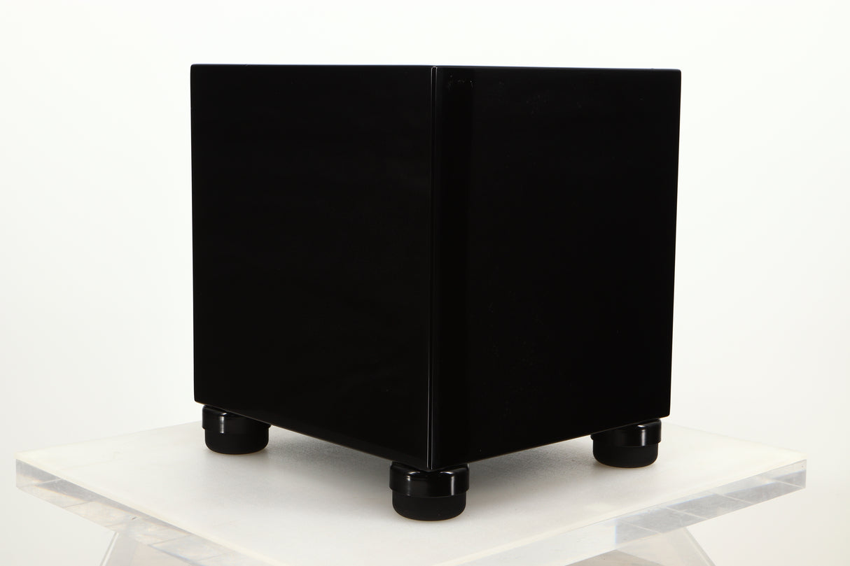 Front left corner view of a used REL T5i Subwoofer in Piano Black finish with Upgrade Feet