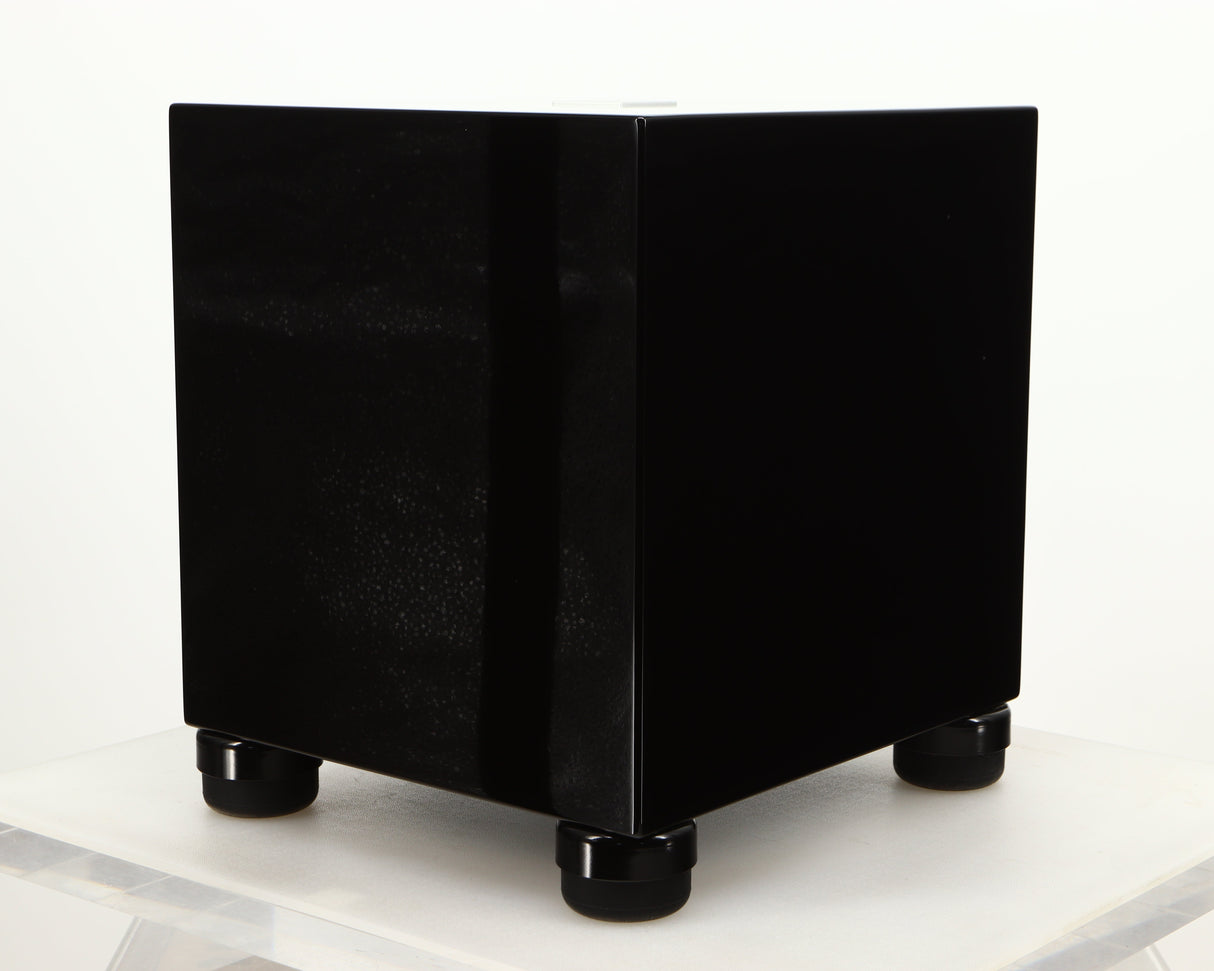 Front right corner of a used REL T5i Subwoofer W/ Upgraded Feet in a piano black finish