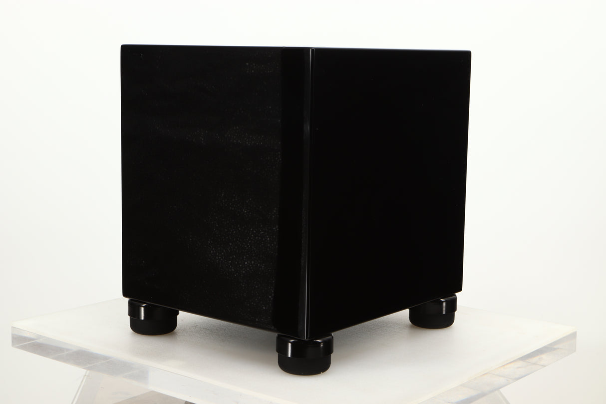 Front right corner view of a used REL T5i Subwoofer in Piano Black finish with Upgrade Feet