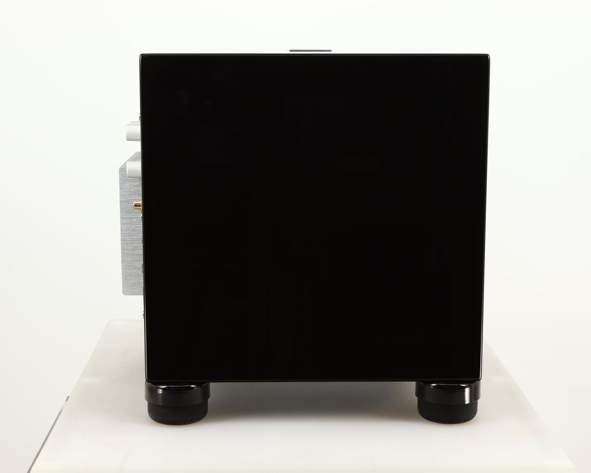Left side view of a used REL T5i Subwoofer W/ Upgraded Feet in a piano black finish
