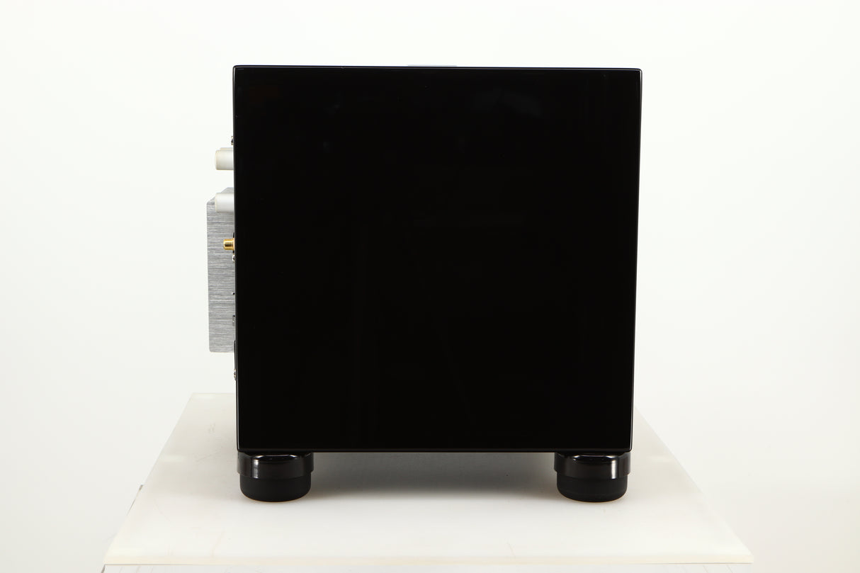 Side view of a used REL T5i Subwoofer in Piano Black finish with Upgrade Feet
