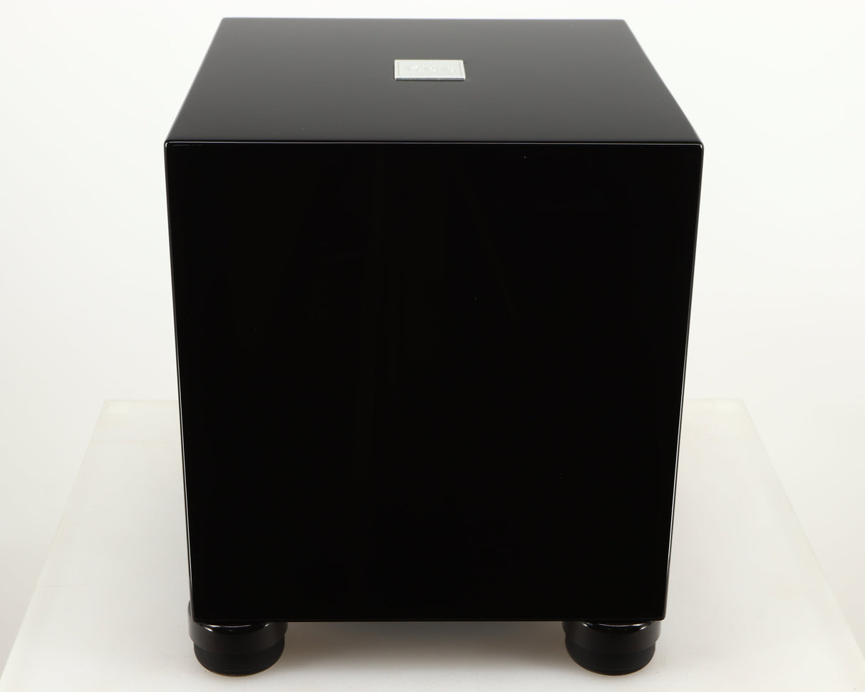 Top of a used REL T5i Subwoofer W/ Upgraded Feet in a piano black finish