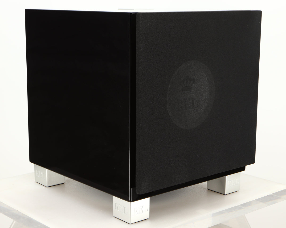 Front left corner of a used REL T7i Subwoofer in a piano black finish