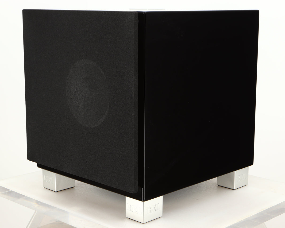 Front right corner of a used REL T7i Subwoofer in a piano black finish