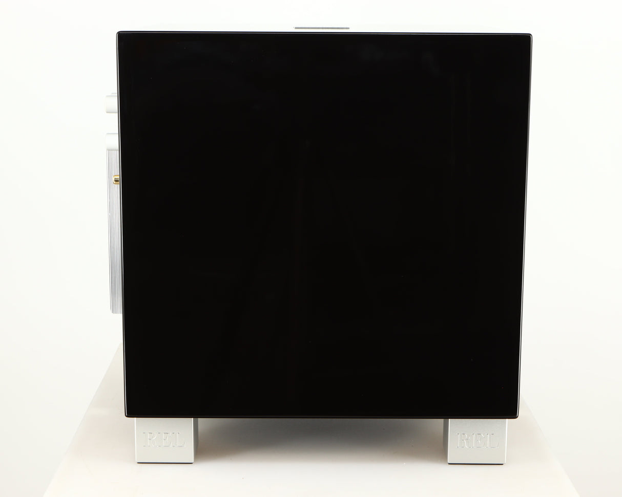 Left side view of a used REL T7i Subwoofer in a piano black finish