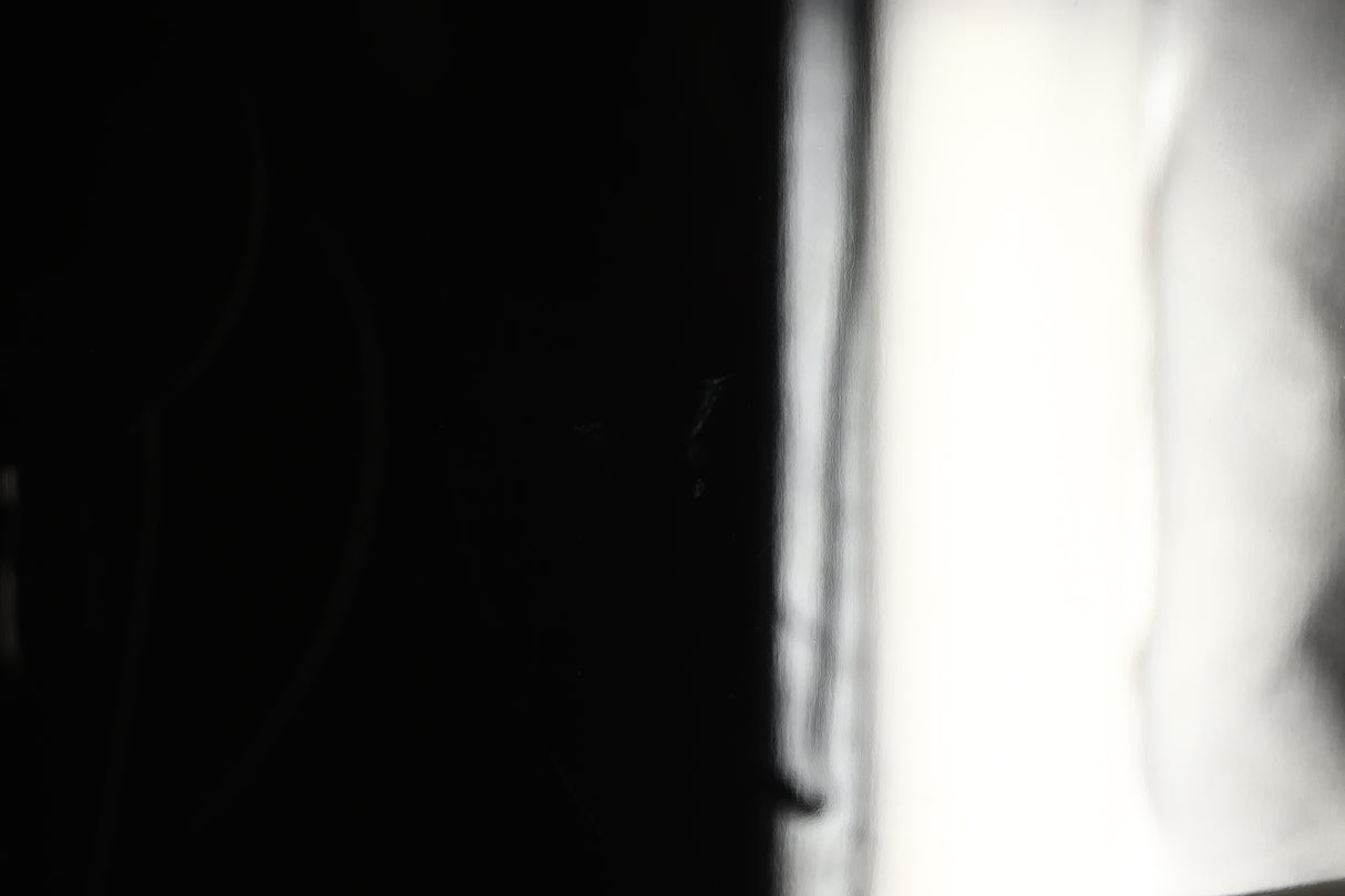 Close up view of a used REL T5X Subwoofer in Piano Black finish