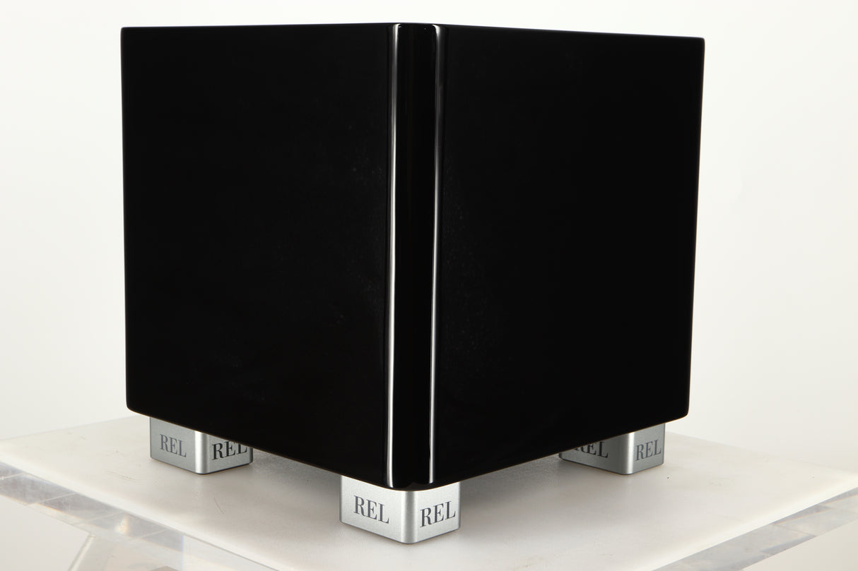 Front right corner view of a used REL T5X Subwoofer in Piano Black finish