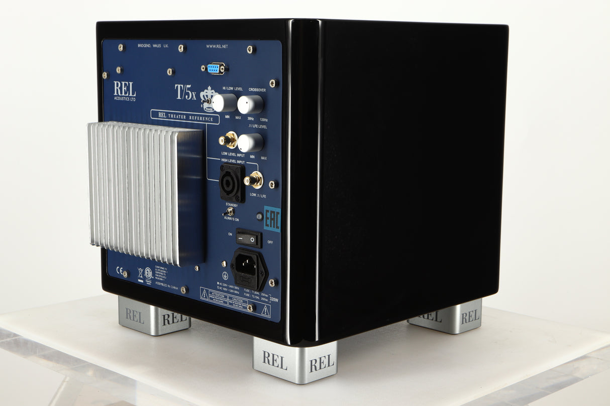 Rear right corner view of a used REL T5X Subwoofer in Piano Black finish