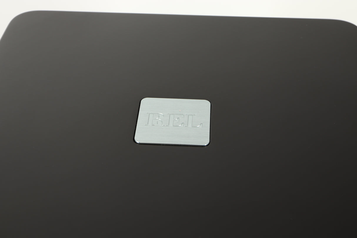 Close up view of a used REL T5X Subwoofer in Piano Black finish