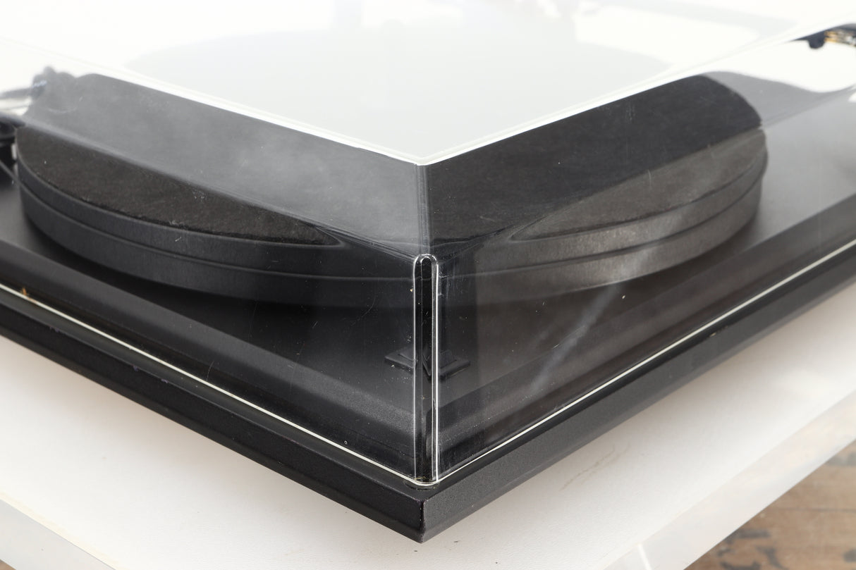 Front left corner of a used Revolver Rebel Turntable / AT95E Cartridge in a black finish