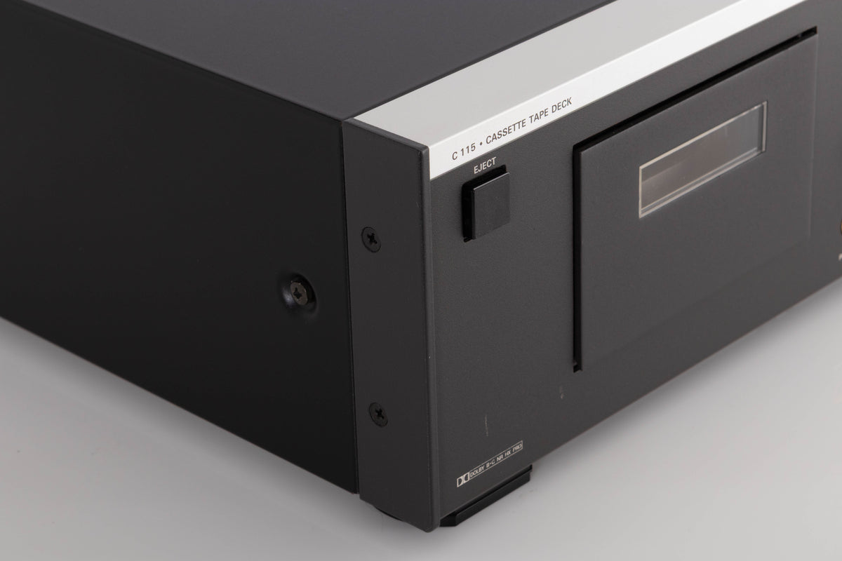 Front left corner of a used Revox C115 Cassette Tape Deck in a Black finish