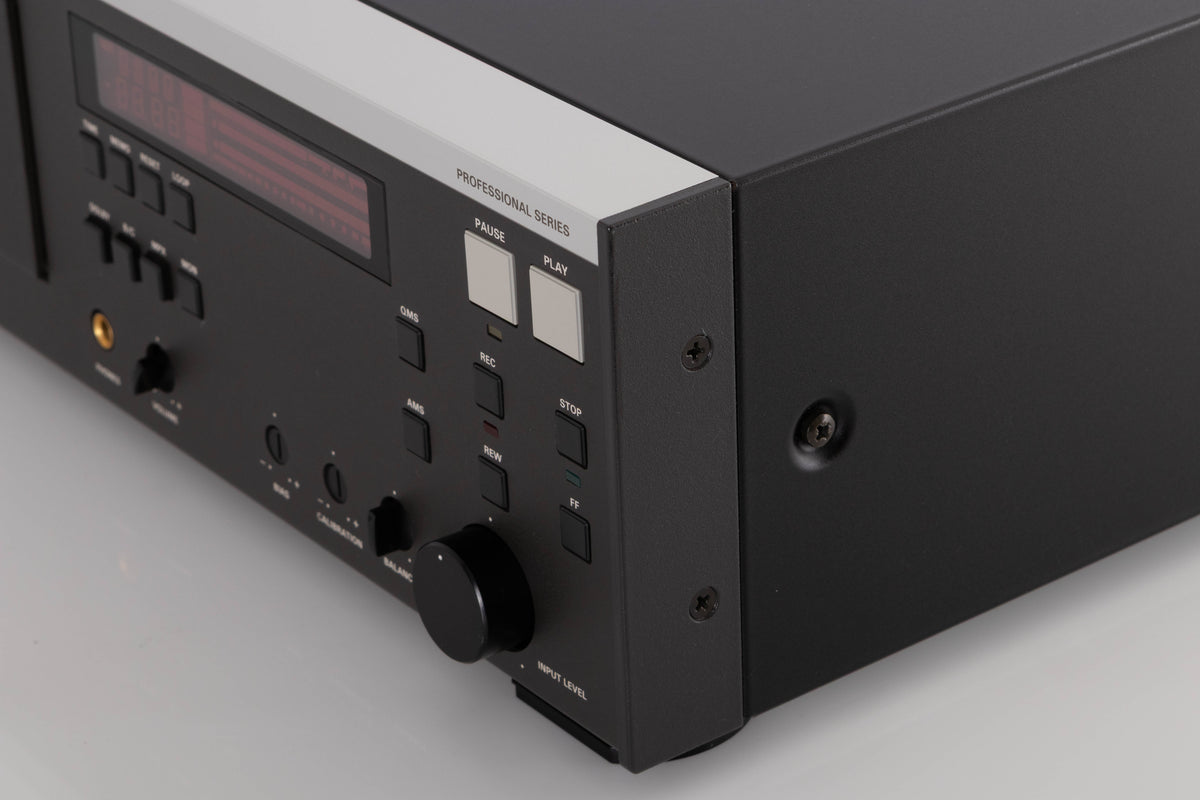 Front right corner of a used Revox C115 Cassette Tape Deck in a Black finish