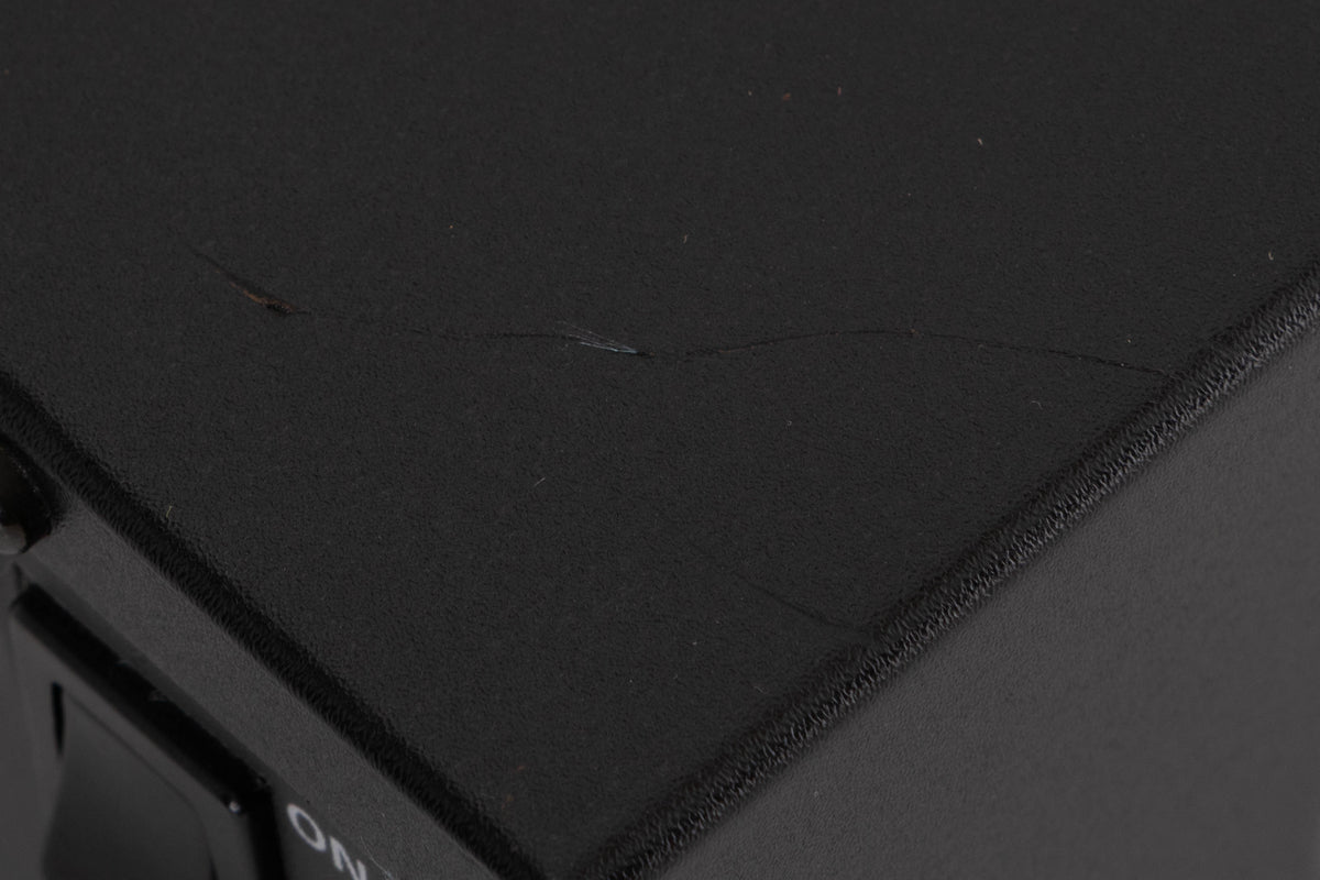 Close up of a used Revox C221 CD Player in a Black finish showing scratches on top