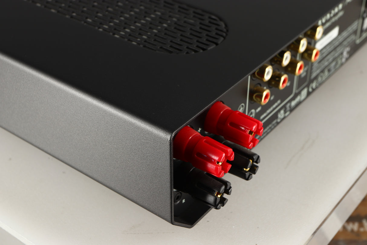 Rear right corner of a used Roksan Attessa Integrated Amplifier in a black finish