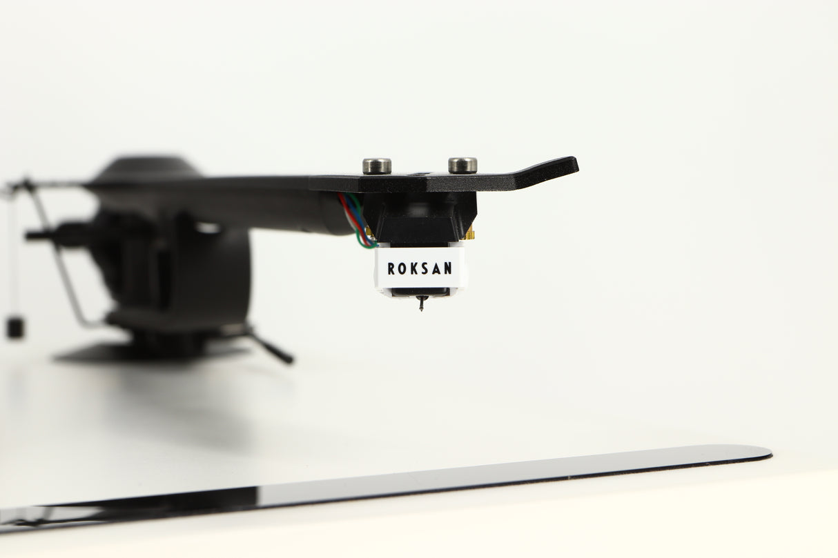 Close up view of a used Roksan Attessa Turntable in White finish showing the cartridge