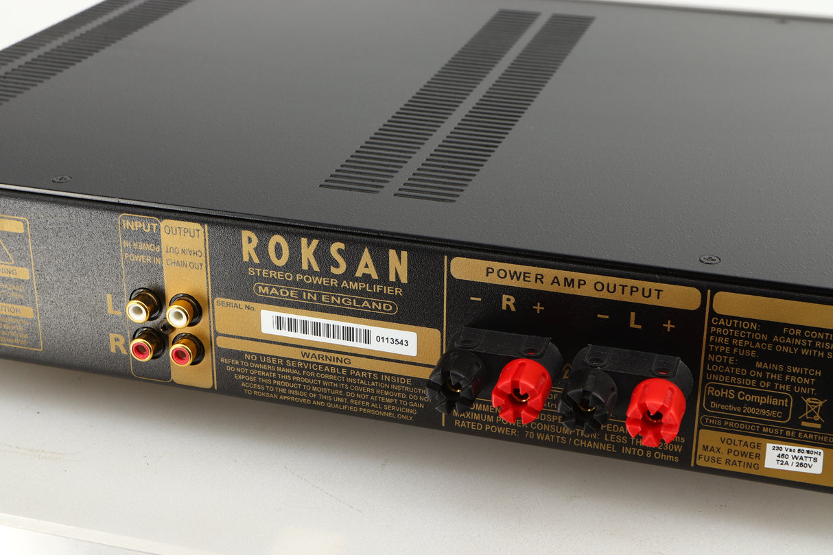 Close up of a used Roksan Caspian MSeries-1 Power Amplifier in a silver finish showing some of the rear
