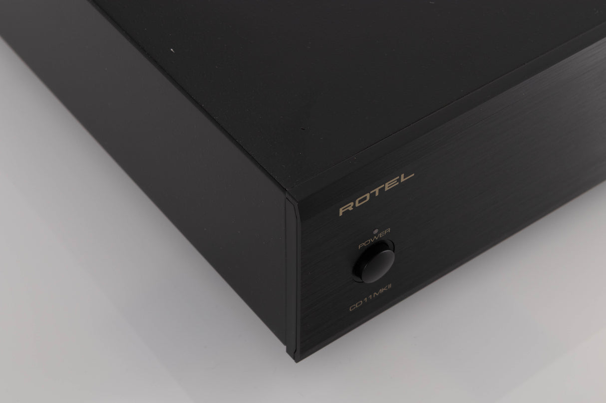 Front left corner of a used Rotel CD11 MKII CD Player in a Black finish