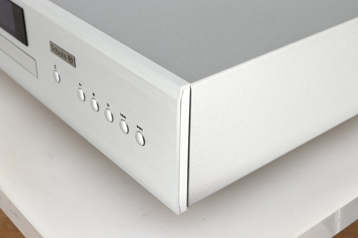 Front right corner of a used Rotel CD11 Tribute CD Player in a silver finish