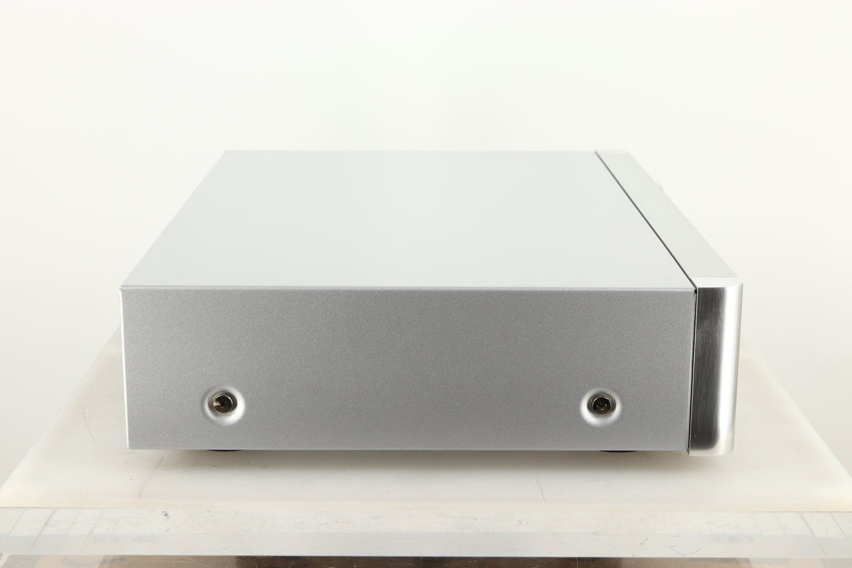 Side view of a used Rotel RC-1572 MKII Pre Amplifier in Silver finish