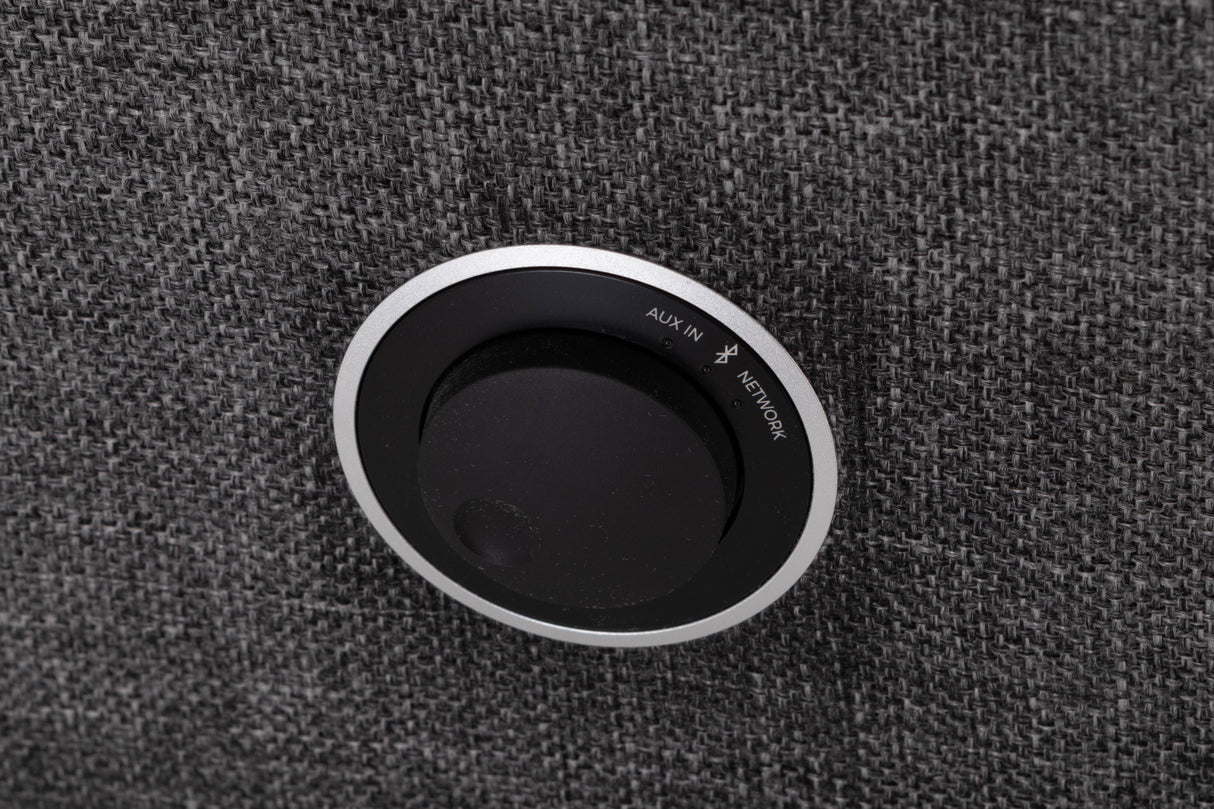 Close up of a used Ruark MRX Streaming Speaker showing control knob